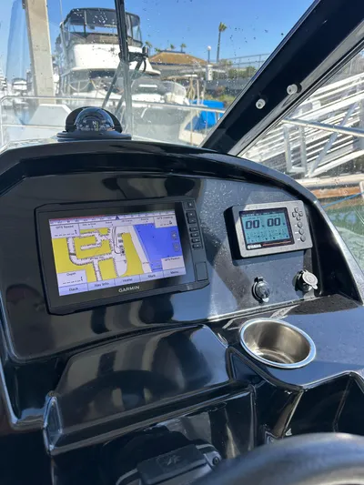 Destination Unknown II Yacht Photos Pics Dashboard of 2021 Jeanneau NC 895 with navigation and control displays.