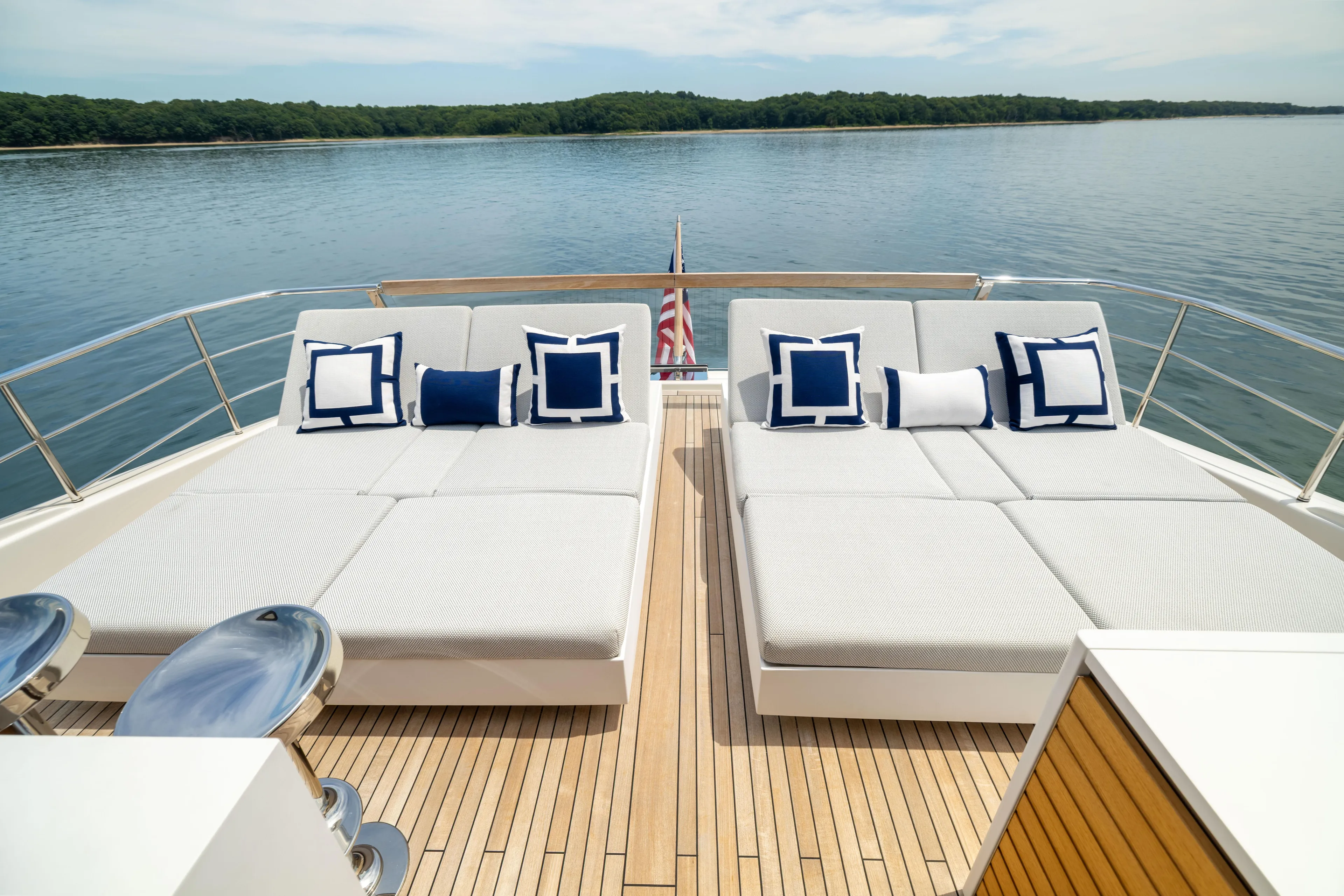 Sori San Lorenzo Yacht Photos Pics Luxurious 2024 Sanlorenzo SL90A yacht deck with elegant sun loungers and scenic water view.