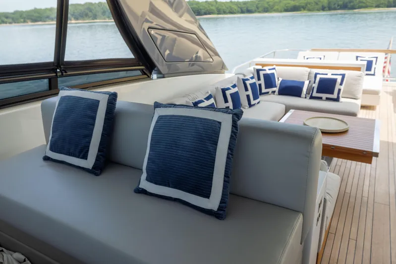 Sori San Lorenzo Yacht Photos Pics Luxurious 2024 Sanlorenzo SL90A yacht deck with elegant seating and blue cushions.