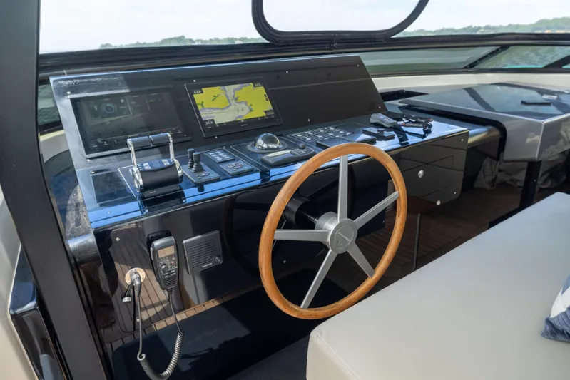 Sori San Lorenzo Yacht Photos Pics 2024 Sanlorenzo SL90A yacht helm with advanced navigation controls and wooden steering wheel.