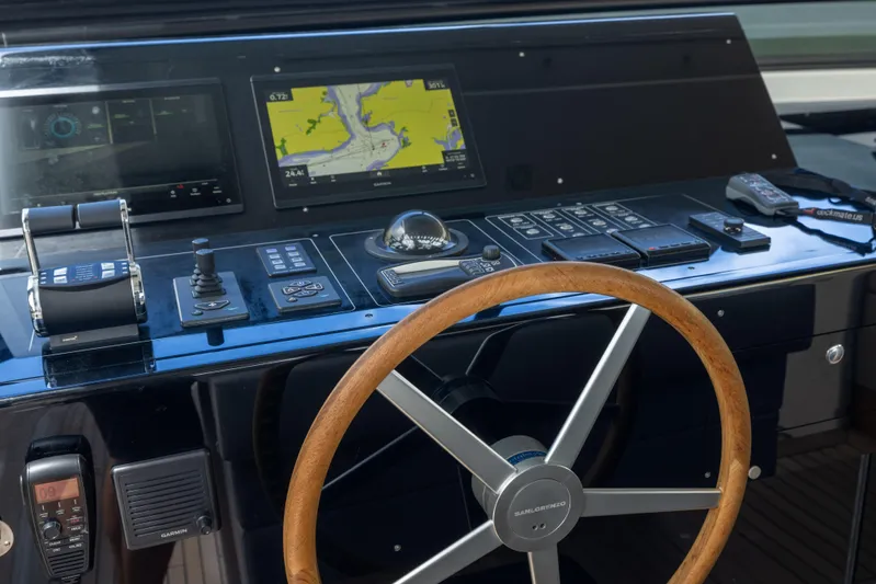 Sori San Lorenzo Yacht Photos Pics 2024 Sanlorenzo SL90A yacht helm with navigation controls and wooden steering wheel.
