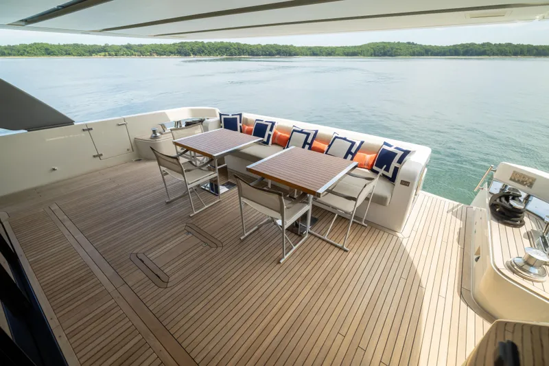 Sori San Lorenzo Yacht Photos Pics Luxurious 2024 Sanlorenzo SL90A yacht deck with elegant seating and scenic water view.