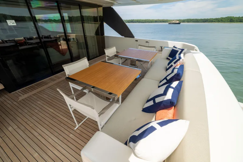 Sori San Lorenzo Yacht Photos Pics Luxurious 2024 Sanlorenzo SL90A yacht deck with elegant seating and scenic water view.