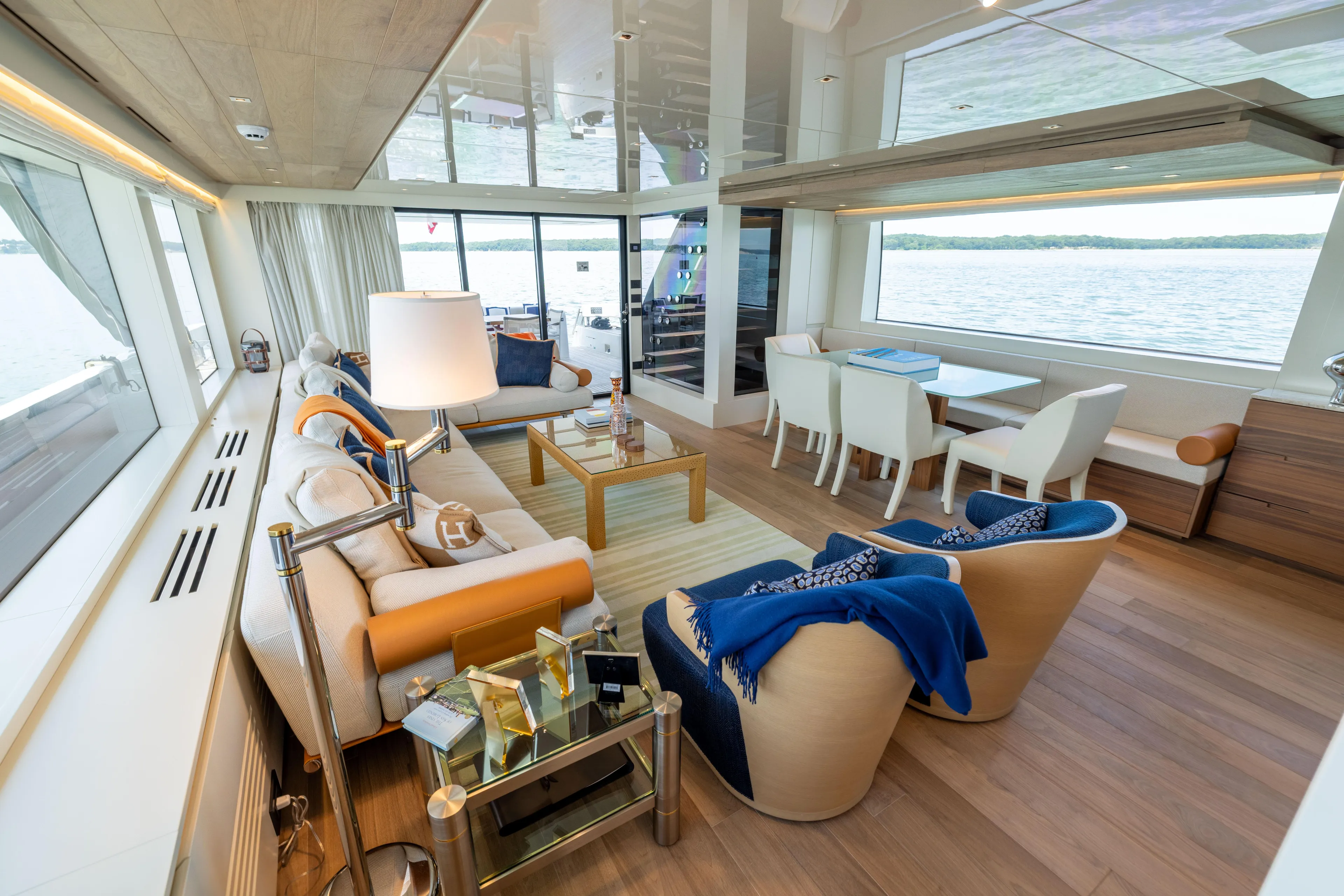 Sori San Lorenzo Yacht Photos Pics Luxurious interior of 2024 Sanlorenzo SL90A yacht with elegant seating and panoramic windows.