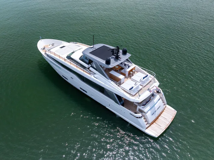 Sori San Lorenzo Yacht Photos Pics 2024 Sanlorenzo SL90A luxury yacht on calm green water, aerial view.