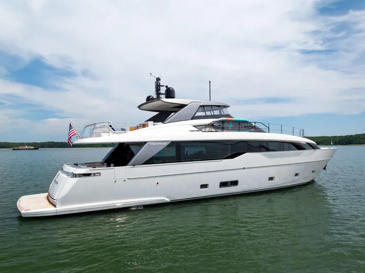 Sori San Lorenzo Yacht Photos Pics 2024 Sanlorenzo SL90A yacht on calm water under a blue sky.
