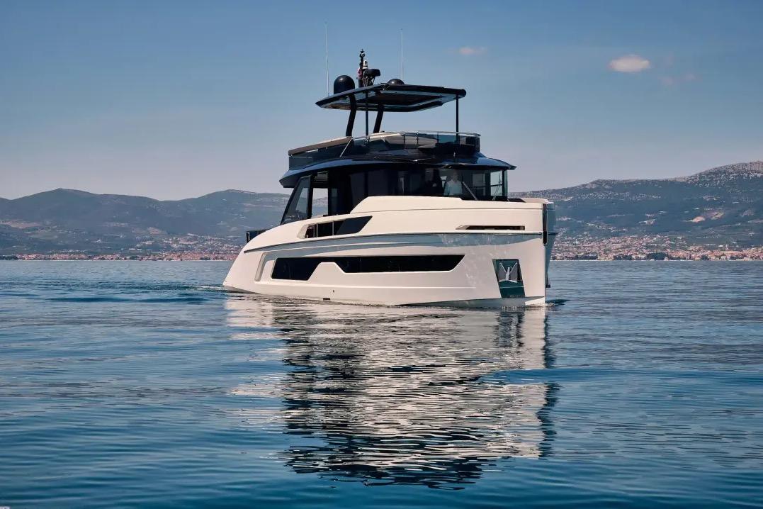 Modern Explorer 62 yacht cruising on calm waters, 2025 model.