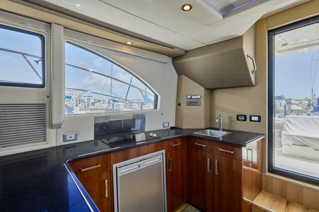  Yacht Photos Pics Luxurious kitchen interior of 2015 Carver C34 Command Bridge yacht with modern amenities.