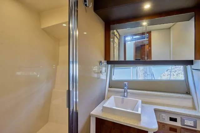  Yacht Photos Pics Modern bathroom in 2015 Carver C34 Command Bridge yacht with sleek fixtures and mirror.