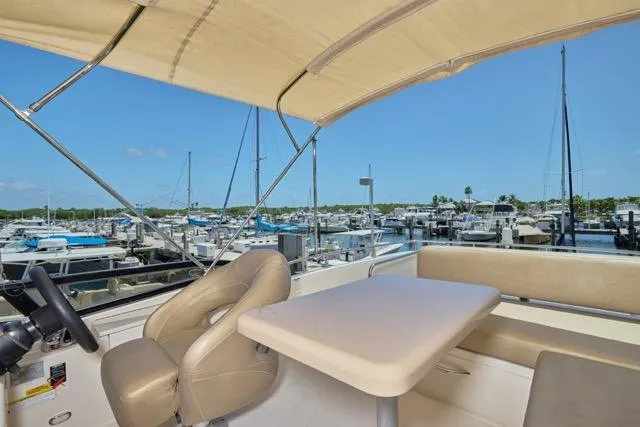  Yacht Photos Pics 2015 Carver C34 Command Bridge yacht interior with seating and marina view.
