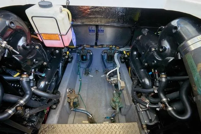  Yacht Photos Pics Engine room of a 2015 Carver C34 Command Bridge, showcasing mechanical components and systems.