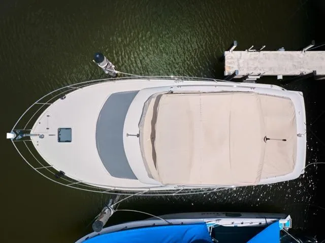  Yacht Photos Pics Overhead view of a 2015 Carver C34 Command Bridge docked at a marina.