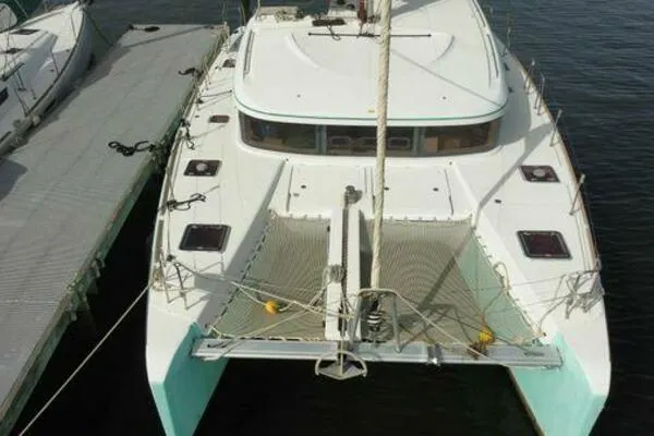 Zun Zun Yacht Photos Pics 2014 Lagoon 39 catamaran docked, aerial view showing deck and netting.