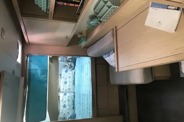 Zun Zun Yacht Photos Pics Interior of 2014 Lagoon 39 catamaran with cozy seating and sleeping area.