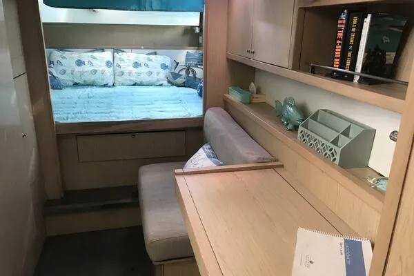 Zun Zun Yacht Photos Pics Interior of 2014 Lagoon 39 catamaran with cozy seating and sleeping area.