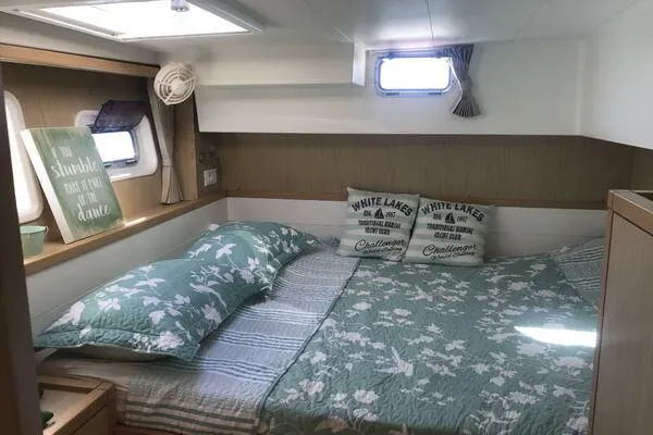 Zun Zun Yacht Photos Pics Cozy bedroom interior of 2014 Lagoon 39 catamaran with floral bedding and decorative pillows.
