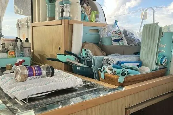 Zun Zun Yacht Photos Pics Interior of 2014 Lagoon 39 yacht kitchen with various utensils and supplies.