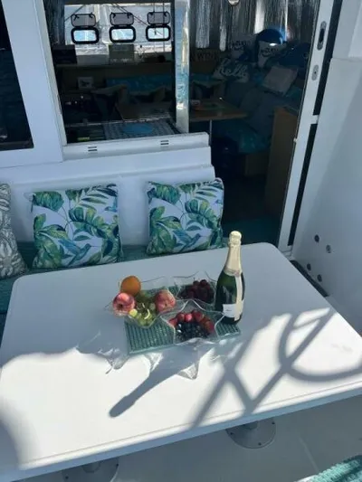 Zun Zun Yacht Photos Pics Luxurious 2014 Lagoon 39 yacht interior with fruit and champagne on table.