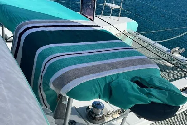Zun Zun Yacht Photos Pics 2014 Lagoon 39 yacht deck with striped towel and turquoise cushions.