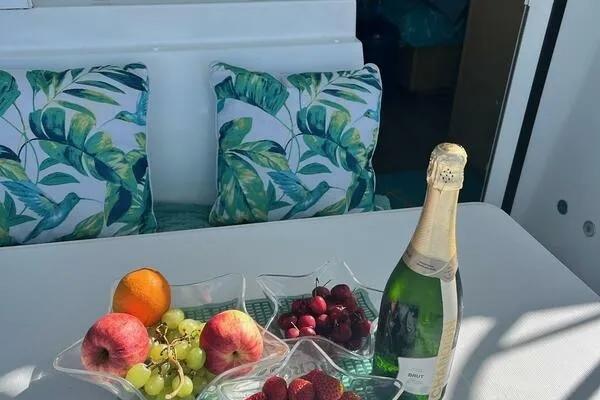 Zun Zun Yacht Photos Pics Luxurious Lagoon 39 yacht interior with fruit, champagne, and tropical-themed cushions, 2014 model.