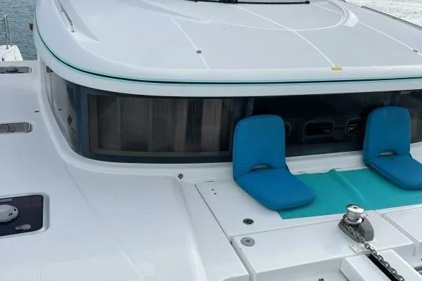 Zun Zun Yacht Photos Pics 2014 Lagoon 39 catamaran deck with blue seating and modern design.