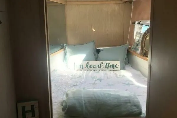 Zun Zun Yacht Photos Pics Cozy bedroom in 2014 Lagoon 39 catamaran with beach-themed decor and soft bedding.