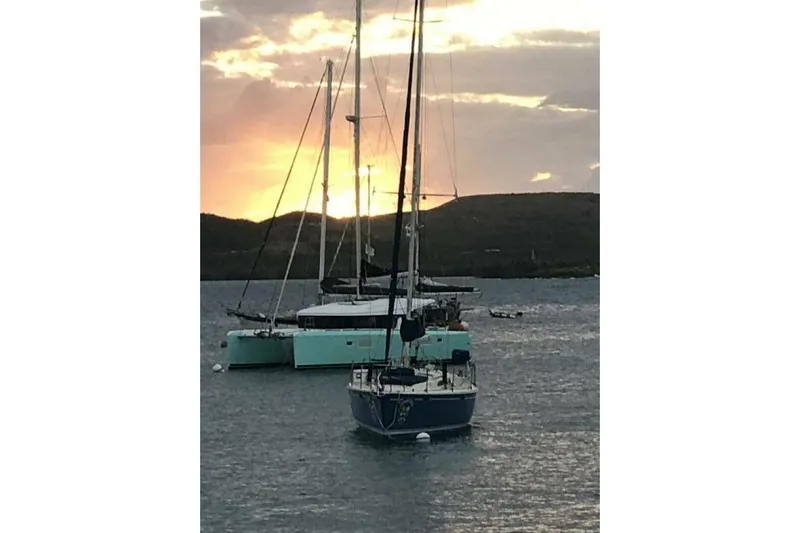 Zun Zun Yacht Photos Pics Sailboats anchored at sunset, featuring a 2014 Lagoon 39 catamaran.