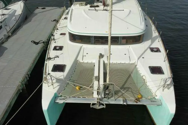 Zun Zun Yacht Photos Pics 2014 Lagoon 39 catamaran docked, aerial view showcasing deck and netting.