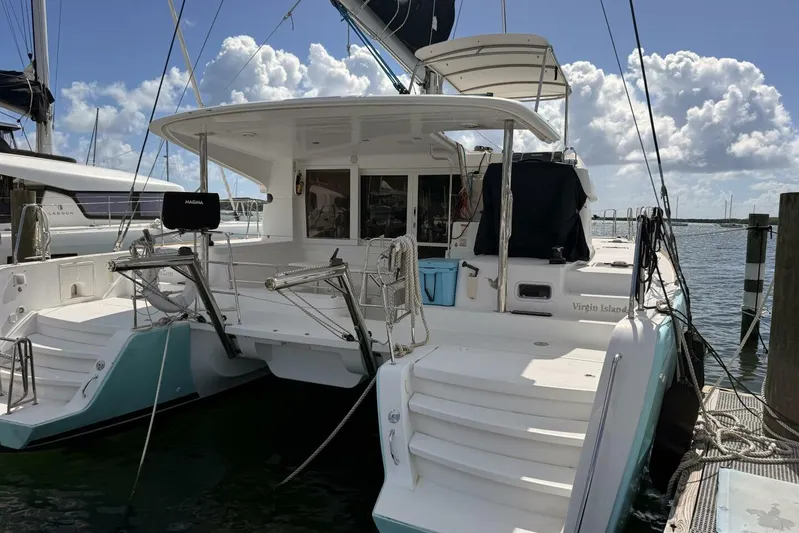 Zun Zun Yacht Photos Pics 2014 Lagoon 39 catamaran docked, featuring spacious deck and clear skies.