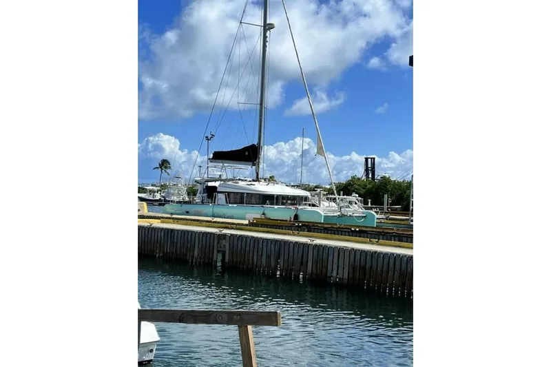 Zun Zun Yacht Photos Pics 2014 Lagoon 39 catamaran docked under a bright blue sky.