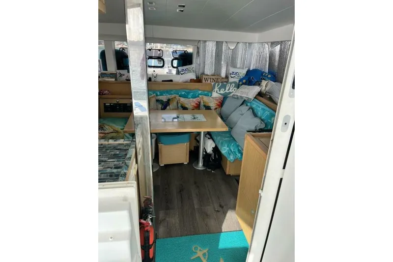 Zun Zun Yacht Photos Pics Interior of 2014 Lagoon 39 catamaran with cozy seating and decorative pillows.
