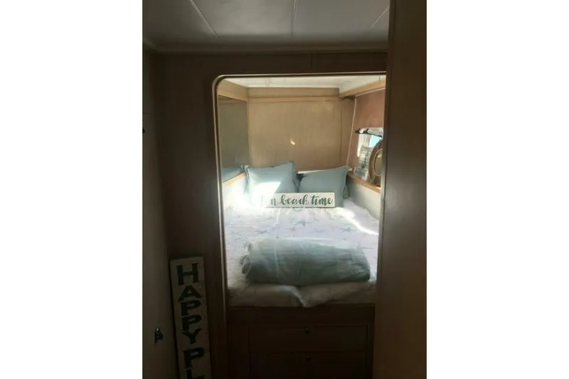 Zun Zun Yacht Photos Pics Cozy cabin interior of 2014 Lagoon 39 catamaran with bed and pillows.