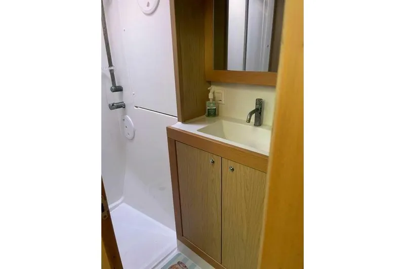 Zun Zun Yacht Photos Pics Bathroom interior of 2014 Lagoon 39 yacht with wooden cabinetry and modern fixtures.
