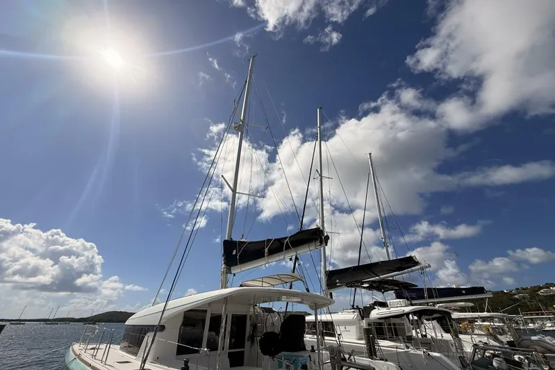 Zun Zun Yacht Photos Pics 2014 Lagoon 39 catamaran docked under a bright sunny sky.