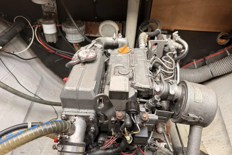 Zun Zun Yacht Photos Pics Engine compartment of a 2014 Lagoon 39 catamaran, showcasing mechanical components and wiring.