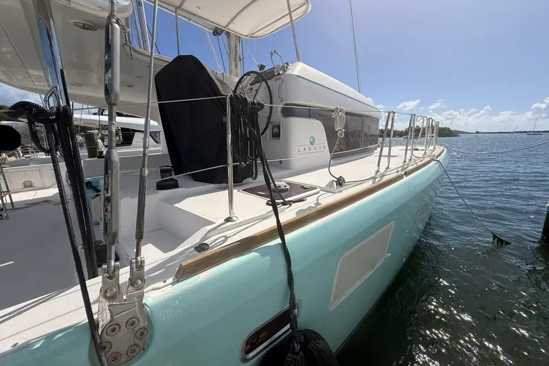 Zun Zun Yacht Photos Pics 2014 Lagoon 39 catamaran docked, featuring sleek design and turquoise hull.