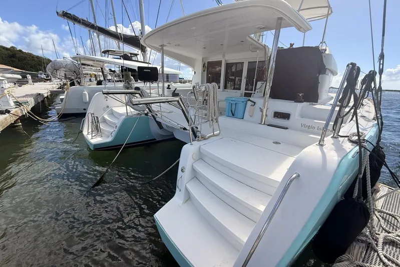 Zun Zun Yacht Photos Pics 2014 Lagoon 39 catamaran docked at marina, featuring spacious deck and modern design.