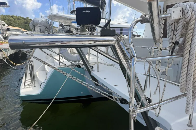 Zun Zun Yacht Photos Pics 2014 Lagoon 39 catamaran docked, featuring stainless steel railings and ropes.