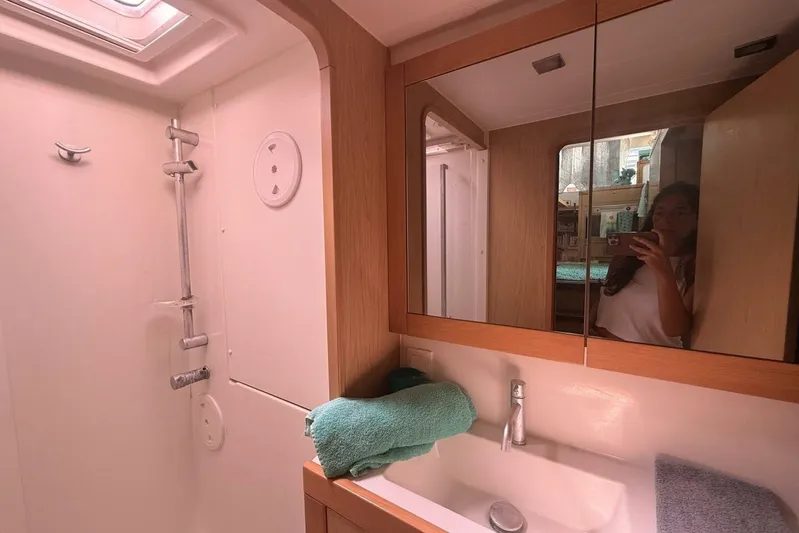 Zun Zun Yacht Photos Pics Bathroom interior of 2014 Lagoon 39 catamaran with shower and mirror cabinet.