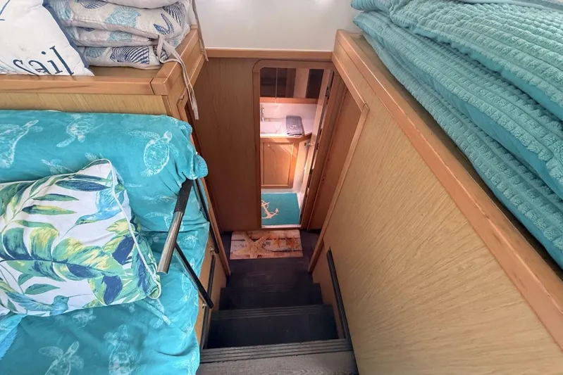 Zun Zun Yacht Photos Pics Interior of 2014 Lagoon 39 yacht with turquoise decor and wooden stairs.
