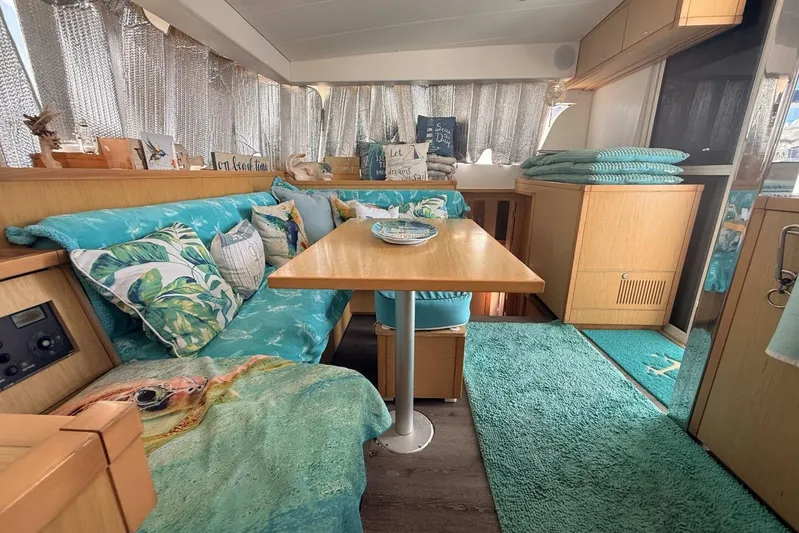 Zun Zun Yacht Photos Pics Interior of 2014 Lagoon 39 catamaran with turquoise decor and wooden furnishings.