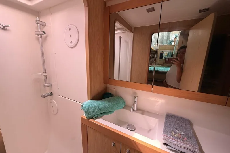 Zun Zun Yacht Photos Pics Bathroom interior of 2014 Lagoon 39 yacht with shower and sink.
