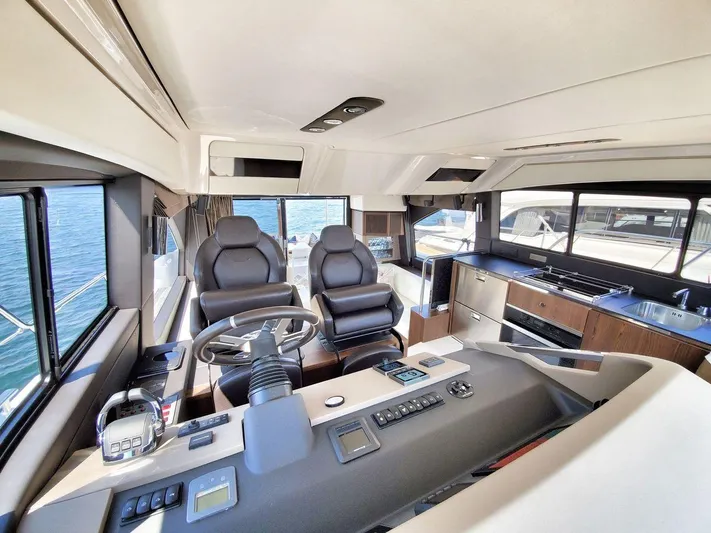  Yacht Photos Pics Luxurious 2018 Azimut 50 Flybridge yacht interior with modern helm and sleek kitchen area.