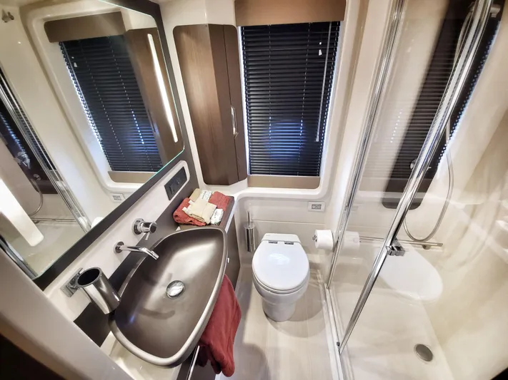  Yacht Photos Pics Luxurious bathroom in 2018 Azimut 50 Flybridge yacht with modern fixtures and elegant design.