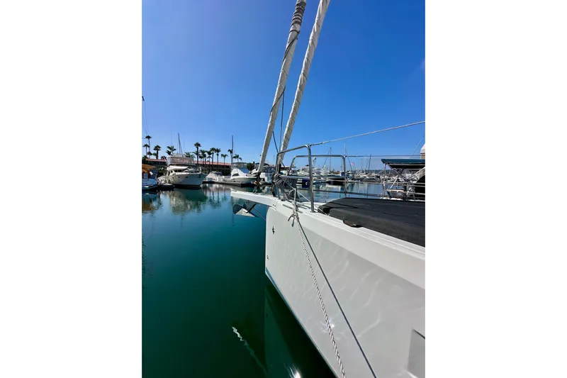 Best Day Ever Yacht Photos Pics Jeanneau Sun Odyssey 410 sailboat docked in a marina, 2022 model, clear blue sky.