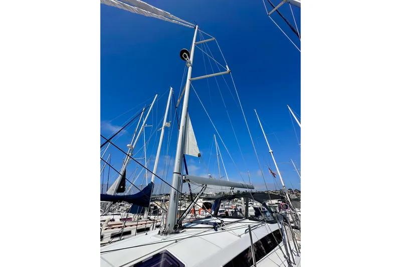 Best Day Ever Yacht Photos Pics Jeanneau Sun Odyssey 410 sailboat mast against clear blue sky, 2022 model.