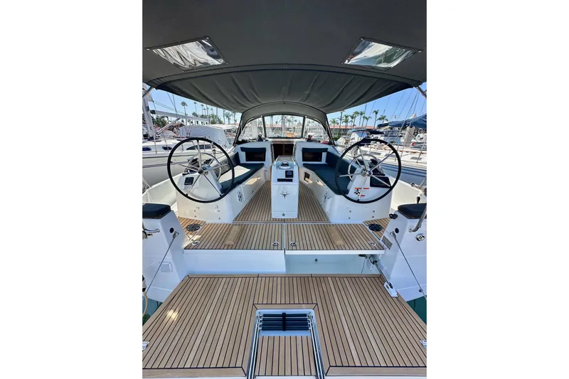 Best Day Ever Yacht Photos Pics Cockpit of 2022 Jeanneau Sun Odyssey 410 sailboat with dual steering wheels.