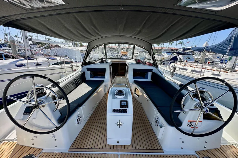 Best Day Ever Yacht Photos Pics 2022 Jeanneau Sun Odyssey 410 yacht cockpit with dual steering wheels and sleek design.