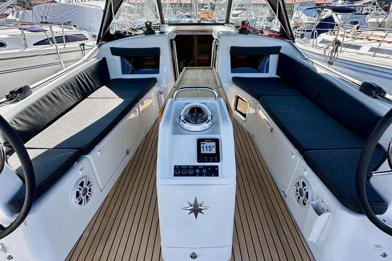 Best Day Ever Yacht Photos Pics Jeanneau Sun Odyssey 410 cockpit, 2022 model, featuring sleek seating and modern navigation equipment.