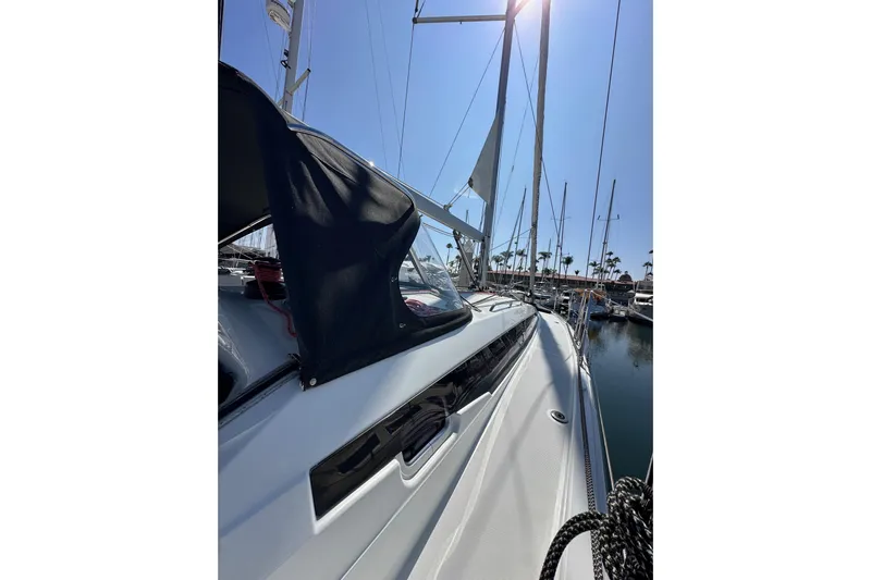 Best Day Ever Yacht Photos Pics 2022 Jeanneau Sun Odyssey 410 sailboat docked in a sunny marina.